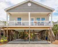 Marsh-view rental home at sunset on Folly Beach